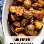 Air fryer baby red potatoes in a bowl with text on the image.