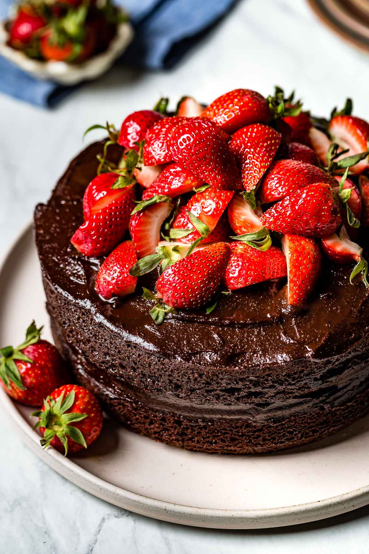 Almond flour chocolate cake topped off with strawberries as an example for almond flour desserts.