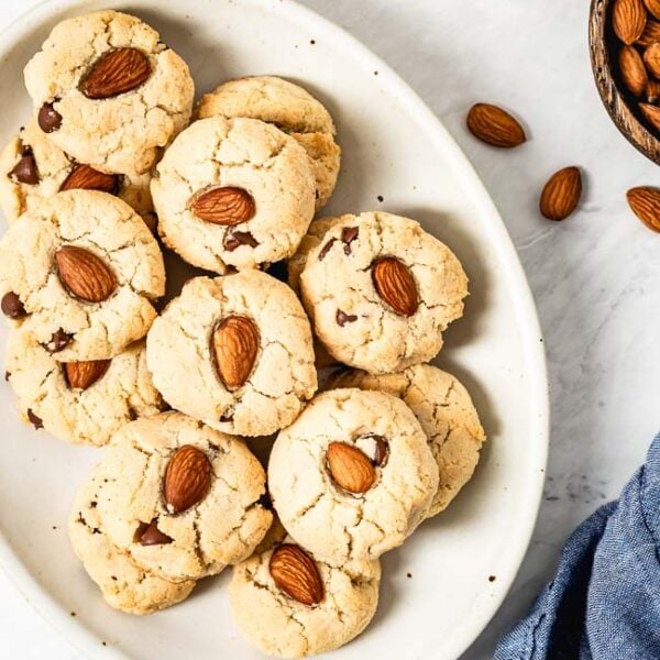 Almond flour cookies with chocolate chips on a white plate