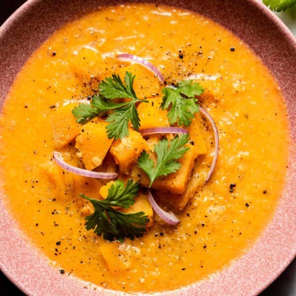 butternut squash thai curry soup in a bowl from the top view