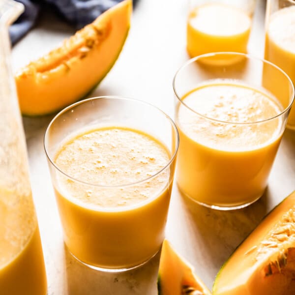 Cantaloupe smoothie in a few glasses from the front view