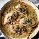Chicken stew with mushrooms in skillet from top view