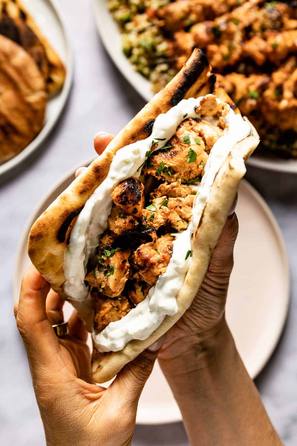 Chicken tawook sandwich served with tzatziki in a lavash bread.