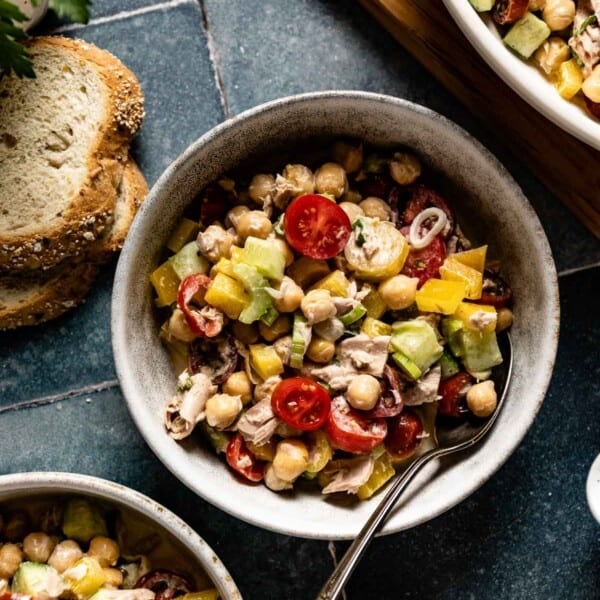 Chickpea Salad with Tuna in a small bowl with bread on the side.