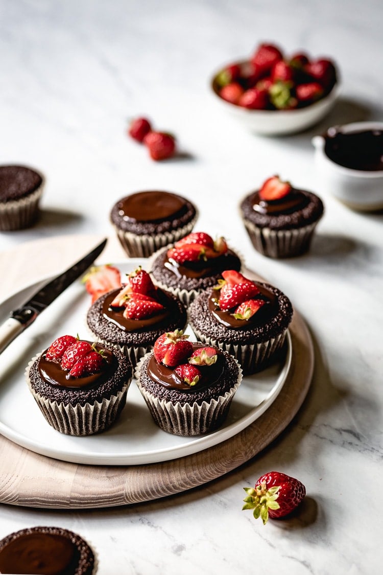 Almond Flour Chocolate Cupcakes topped off with strawberries.