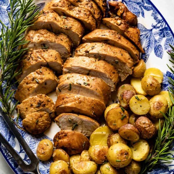 Turkey tenderloin with roasted potatoes on the side from the top view.