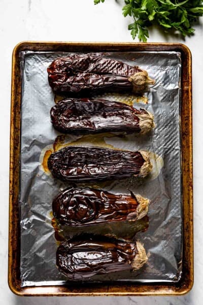 Roasted Whole Eggplants on a sheet pan from top view