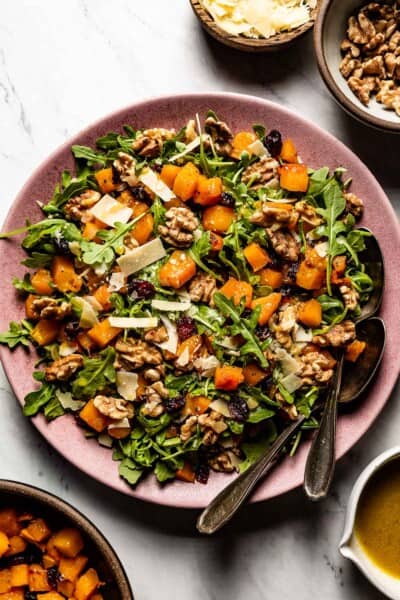 Roasted butternut squash salad on a plate from top view