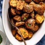Air fryer roasted red potatoes in a bowl with a spoon on the side.