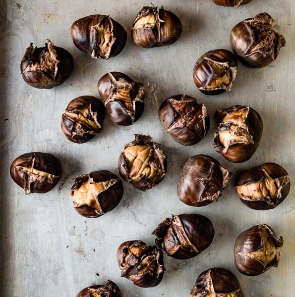 roasted chestnuts on a sheet pan from top view