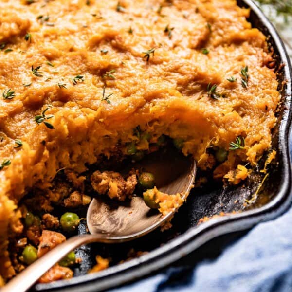 A close-up of a sweet potato shepherd's pie in a skillet.