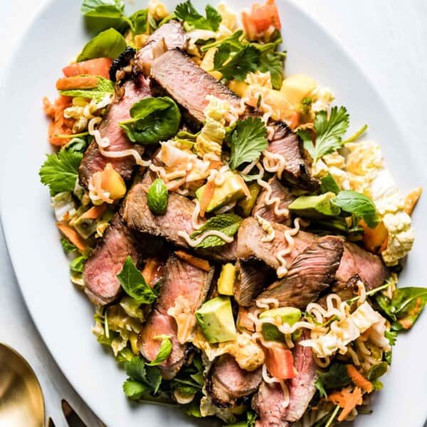 Thai Steak and noodle salad in an oval plate from the top view